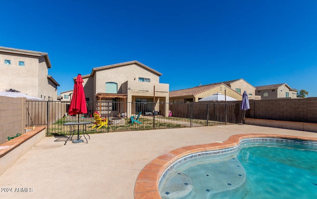 view of swimming pool featuring a patio area