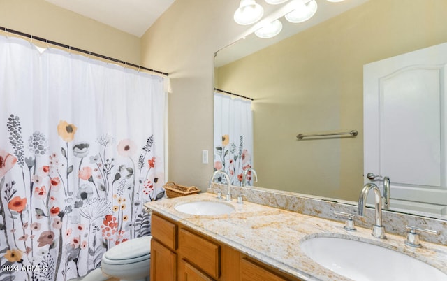 bathroom with vanity, toilet, and a shower with shower curtain