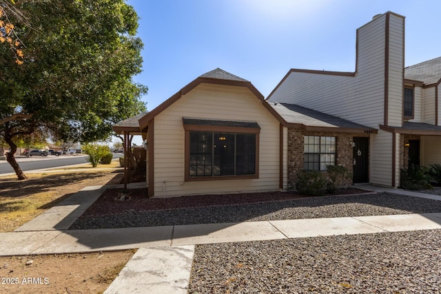 view of front of house with brick siding