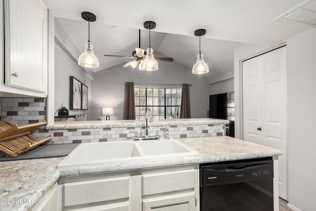 kitchen with black dishwasher, visible vents, lofted ceiling, light countertops, and a sink