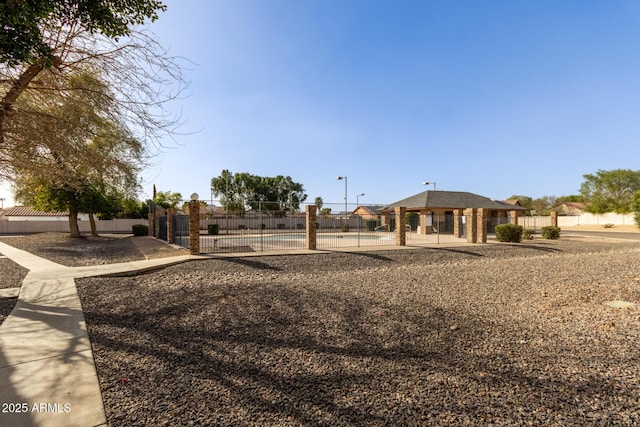 view of yard with a fenced in pool and fence