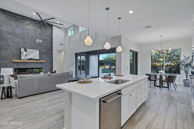 11717 W Red Hawk Dr, Peoria, AZ 85383 - kitchen with dishwasher, plenty of natural light, recessed lighting, light countertops, and white cabinets