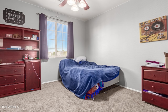 bedroom with ceiling fan and light colored carpet