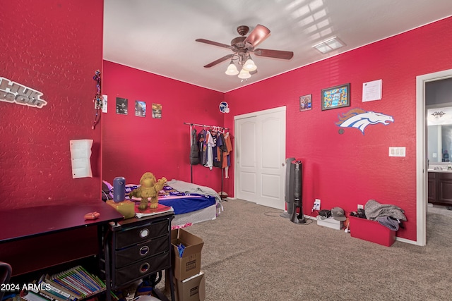 bedroom with carpet flooring, a closet, and ceiling fan