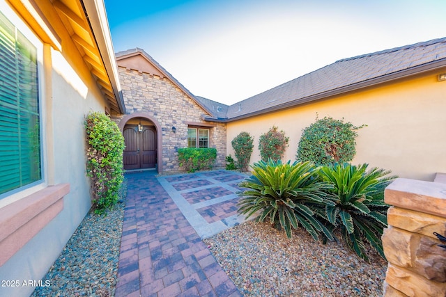 doorway to property featuring a patio