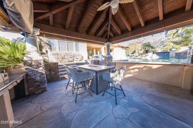 view of patio / terrace with ceiling fan and a gazebo