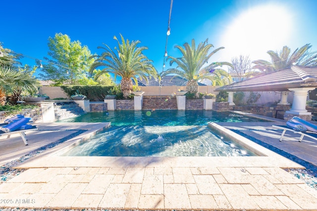 view of swimming pool with a gazebo and a patio area