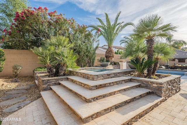 view of community with a jacuzzi