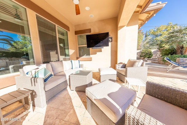 view of patio featuring ceiling fan and an outdoor hangout area