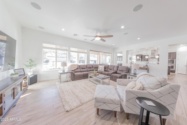 living room featuring ceiling fan