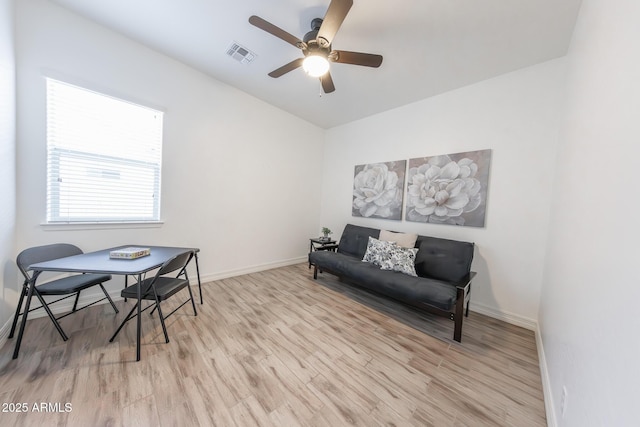 sitting room with ceiling fan and light hardwood / wood-style flooring