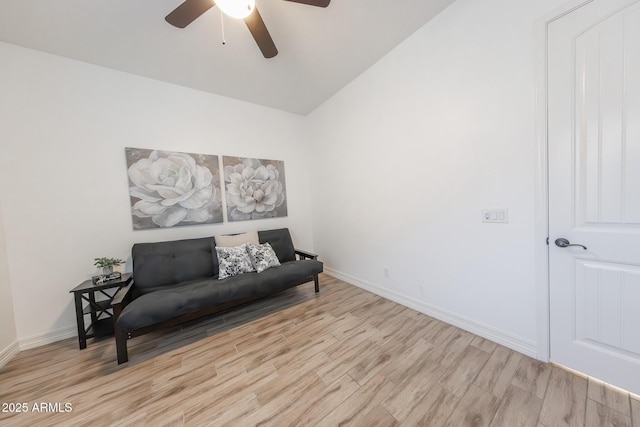 sitting room with lofted ceiling, ceiling fan, and light wood-type flooring