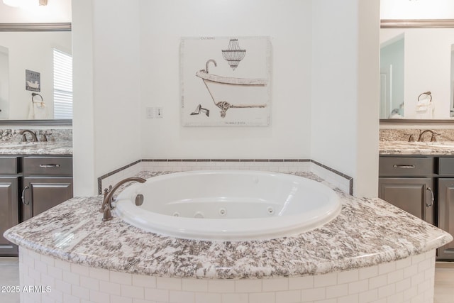 bathroom with a relaxing tiled tub and vanity