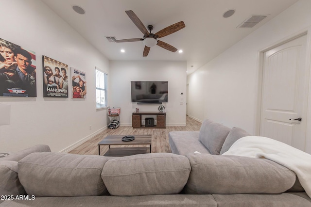 living room featuring ceiling fan and light wood-type flooring