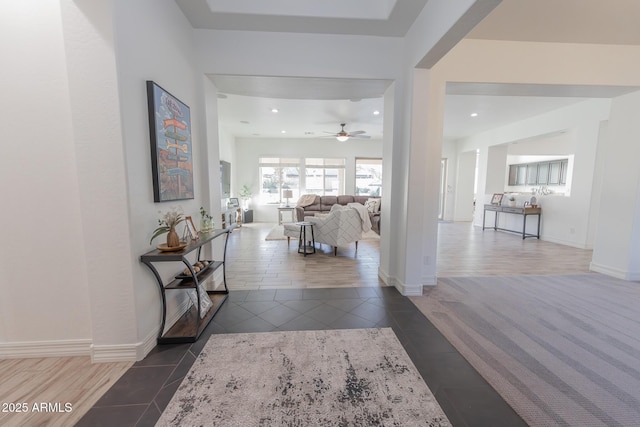 hall featuring dark tile patterned flooring