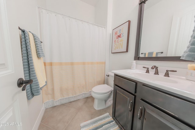 bathroom featuring toilet, vanity, and tile patterned floors