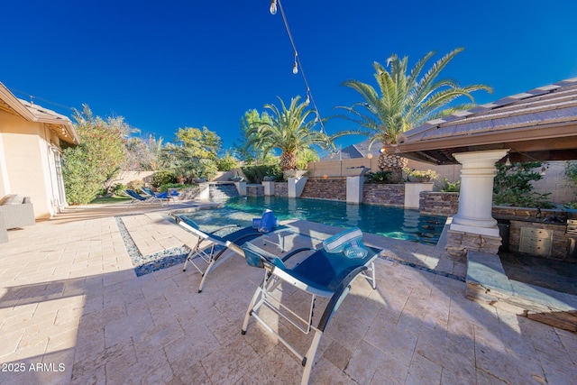 view of patio featuring a gazebo and a fenced in pool