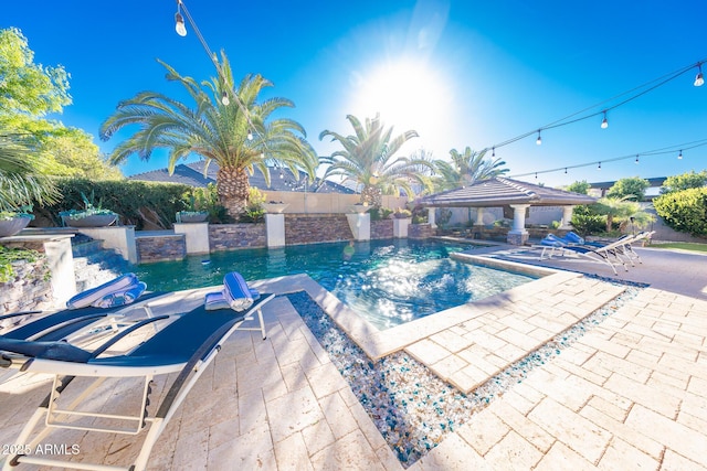 view of pool with a patio and a gazebo