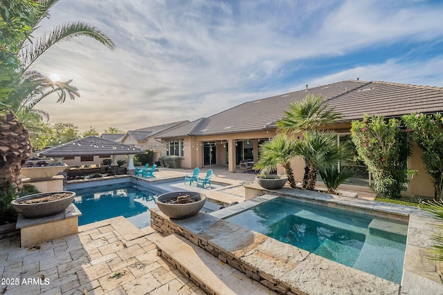 view of swimming pool with a gazebo, a patio area, and a jacuzzi