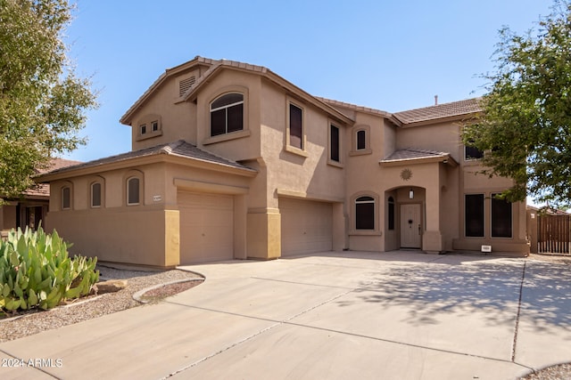 mediterranean / spanish-style house featuring a garage