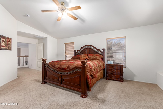 carpeted bedroom with lofted ceiling and ceiling fan