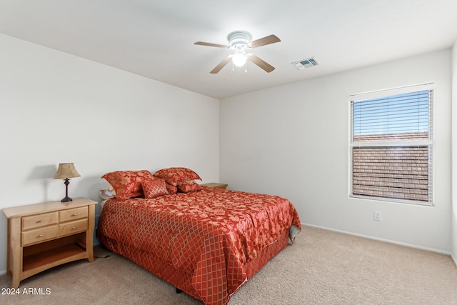 bedroom with light carpet and ceiling fan