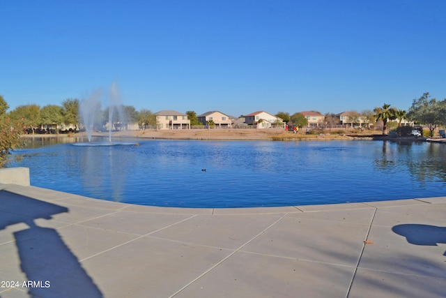 view of pool with a water view