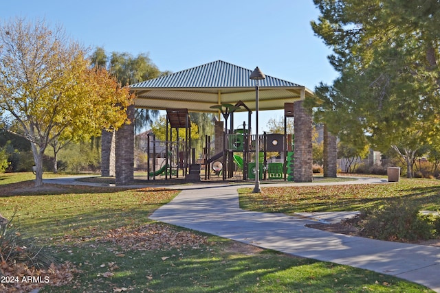 view of community featuring a playground and a yard