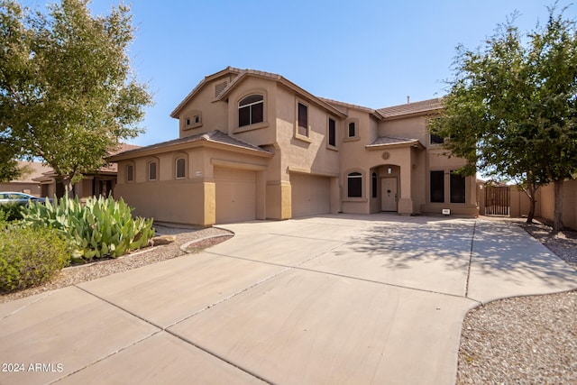 mediterranean / spanish-style house featuring a garage