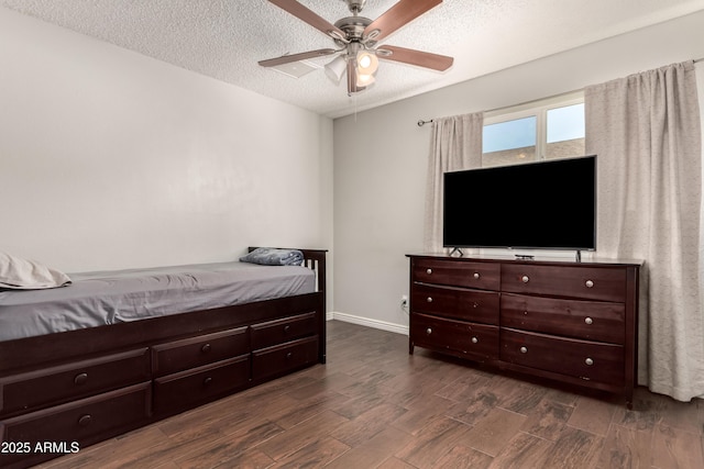 4419 W Vogel Ave, Glendale, AZ 85302 - bedroom featuring dark wood-type flooring, a textured ceiling, and ceiling fan