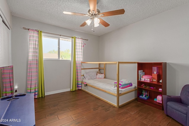 4419 W Vogel Ave, Glendale, AZ 85302 - bedroom featuring wood finished floors, a textured ceiling, a closet, and ceiling fan
