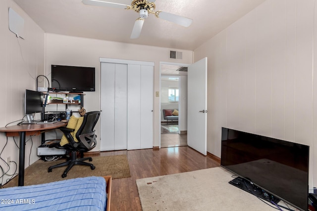 office area with ceiling fan and hardwood / wood-style flooring