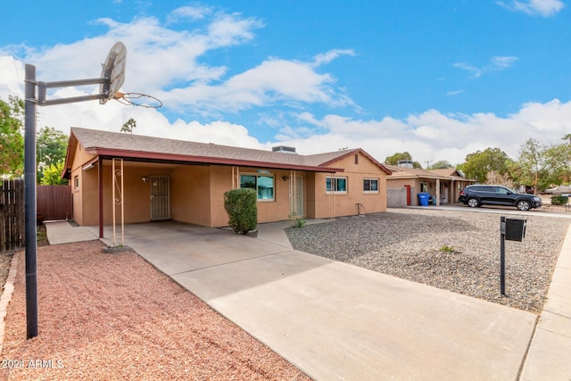 single story home featuring a carport