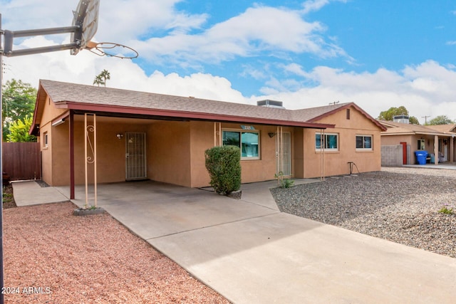 ranch-style house with a patio area