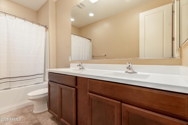 full bathroom featuring double vanity, toilet, shower / bath combination with curtain, and a sink