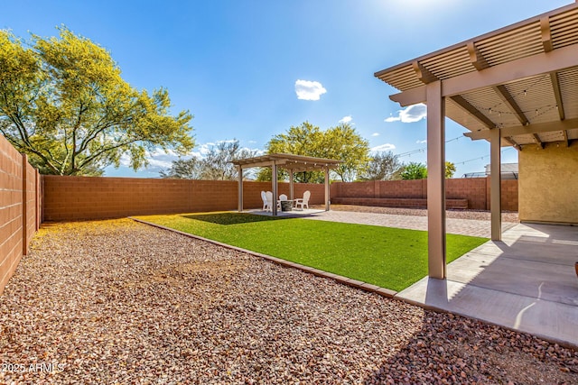 view of yard with a fenced backyard, a pergola, and a patio area