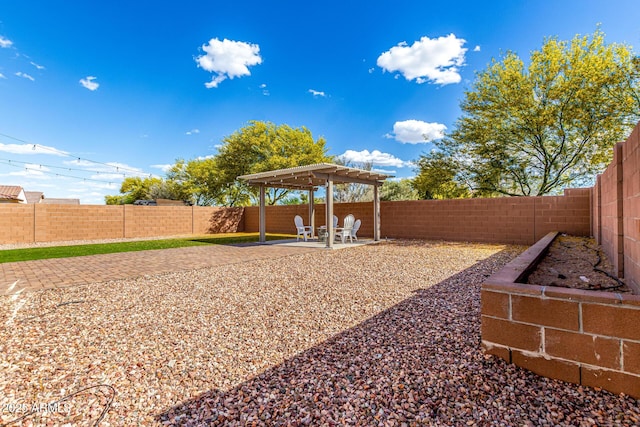 view of yard with a patio, a pergola, and a fenced backyard