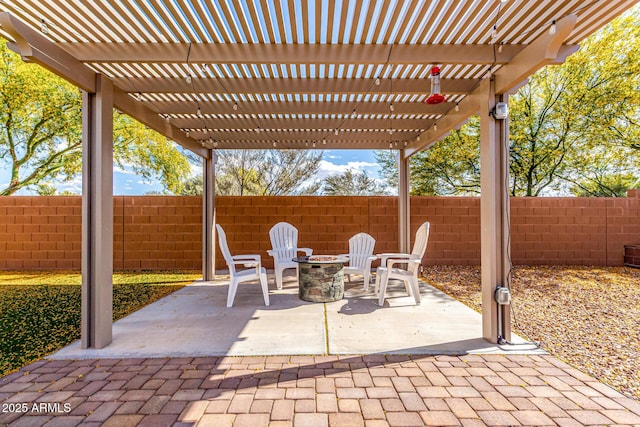view of patio featuring a pergola, fence, and an outdoor fire pit