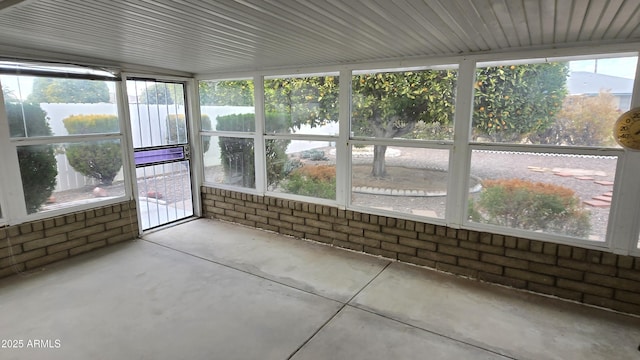 unfurnished sunroom with a wealth of natural light