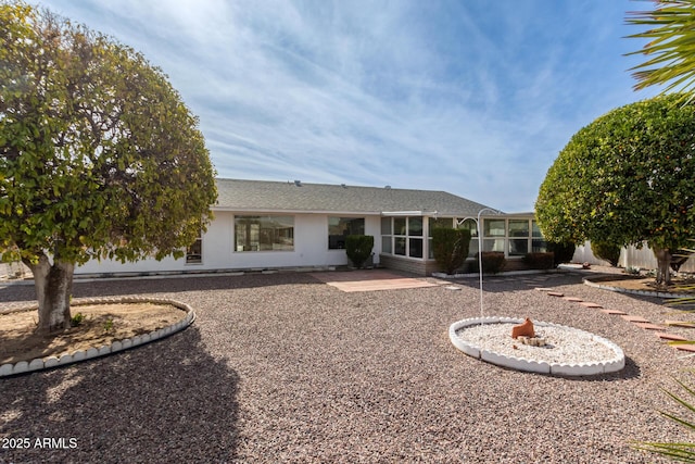 back of property with a patio area