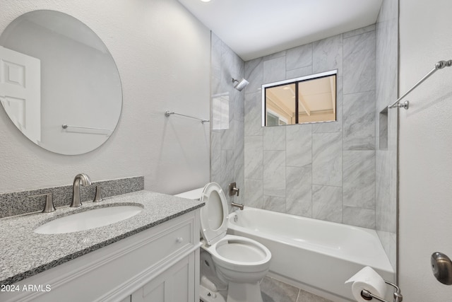 full bathroom featuring vanity, toilet, and tiled shower / bath combo