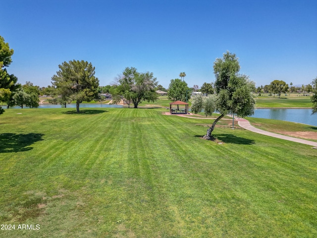 view of yard with a gazebo and a water view