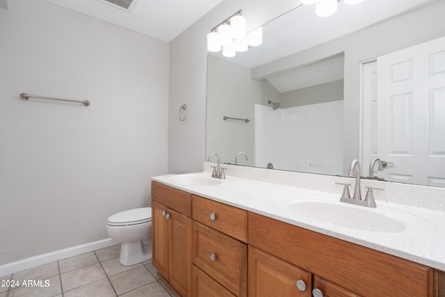 bathroom with walk in shower, tile patterned flooring, vanity, and toilet