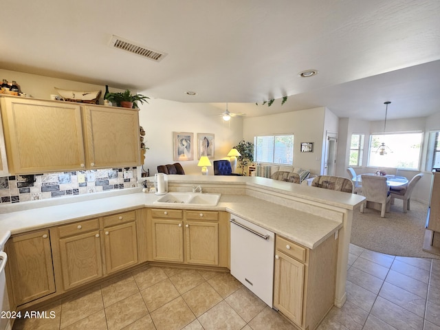 kitchen with white dishwasher, ceiling fan, light tile patterned floors, and sink