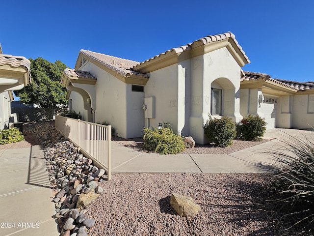 view of property exterior featuring a garage