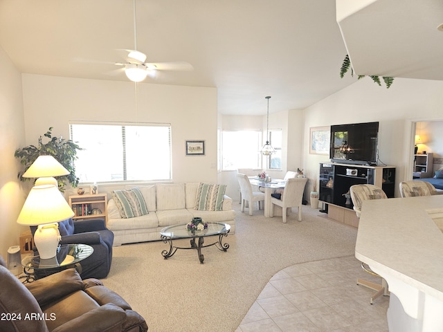 living room with light colored carpet, vaulted ceiling, and ceiling fan