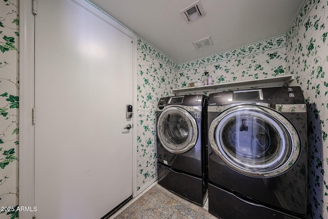 4306 E Raven Rd, Phoenix, AZ 85044 - clothes washing area with wallpapered walls, washing machine and clothes dryer, and baseboards