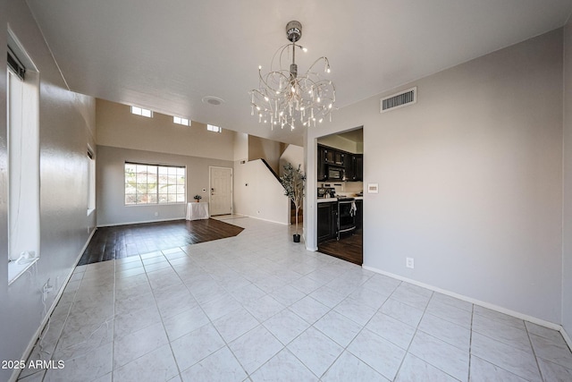 4306 E Raven Rd, Phoenix, AZ 85044 - unfurnished living room with light tile patterned floors, a chandelier, and baseboards