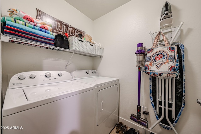 washroom featuring laundry area and washing machine and dryer