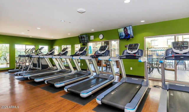 workout area featuring recessed lighting and wood finished floors